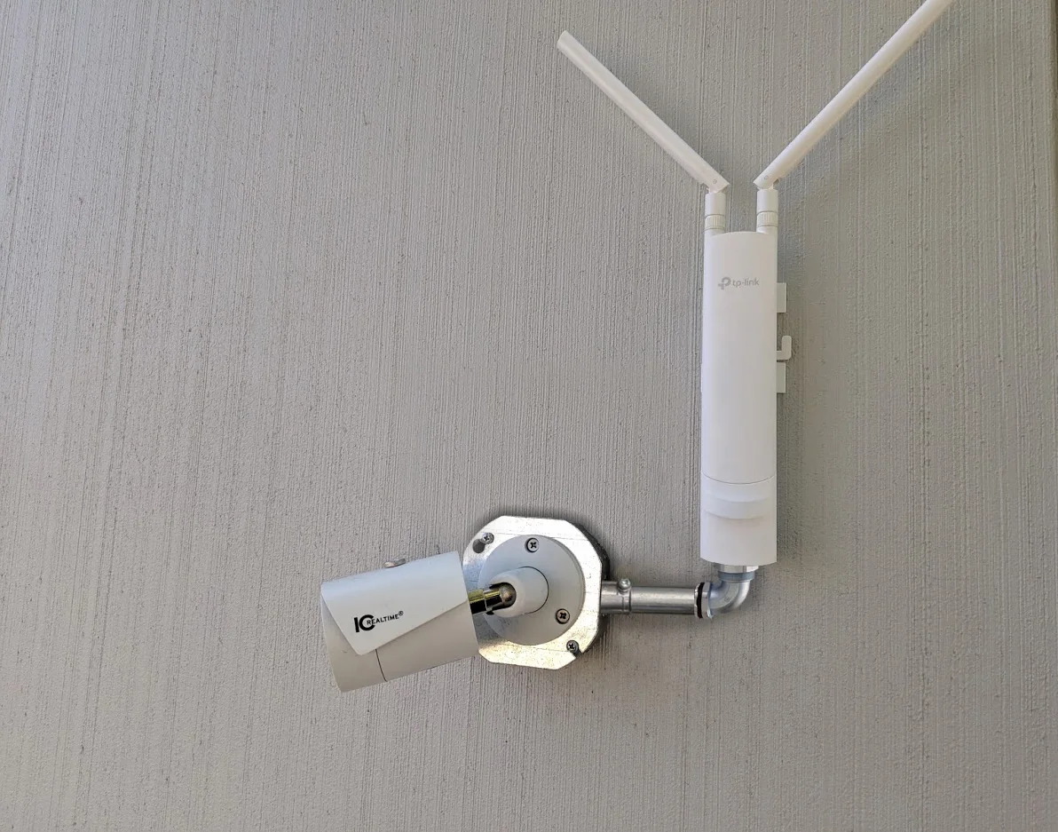 A wall-mounted camera and wireless access point